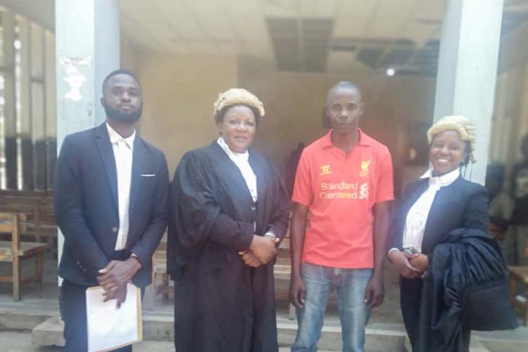 Photo: Kazembe (in red) poses with Counsel after acquittal